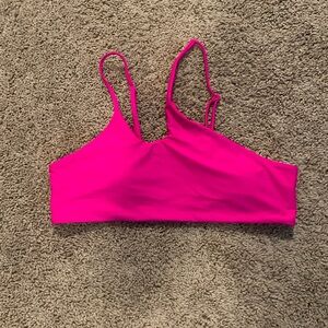 This is a hot pink swimsuit top from Shein.